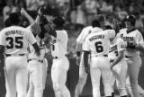 Bo Jackson and his teammates celebrating during a Birmingham Barons baseball game in Birmingham, Alabama.