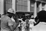 African American protestors and Klansmen at a United Klans of America march in Mobile, Alabama.