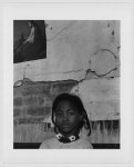 [Store Front Churches. African American girl with portrait of Christ on the wall, East Side, Buffalo, New York]