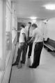 Sergeant Clifford Vasser and Lieutenant Doug Acker booking Anthony Ray Hinton on capital murder charges at the city jail in Bessemer, Alabama.