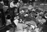 Young civil rights demonstrators lying on a sidewalk after being stopped by police during the Children's Crusade in Birmingham, Alabama.