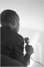 William M. Branch speaking to an audience in a church building, probably First Baptist Church in Eutaw, Alabama.