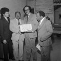 John LeFlore shaking hands with A. J. Cooper outside the International Longshoreman's Association Hall in Mobile, Alabama, before an event commemorating the 111th anniversary of the Emancipation Proclamation.