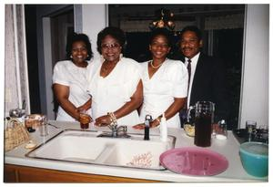 Women and Men in Kitchen During Dorothy Washington Celebration