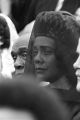 Close-up of Coretta Scott King surrounded by mourners at Martin Luther King, Jr.'s funeral, probably at South View Cemetery.