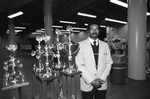 Man with trophies, Los Angeles, 1983