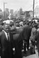 Casket moving down the street during Martin Luther King, Jr.'s funeral procession.