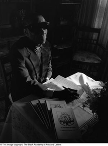 Photograph of Rev. James Garfield Owens and his book #3