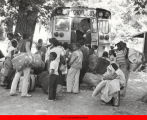 Group of children boarding a bus at camp