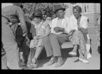 Group of Negroes on bench in square, Marshall, Texas