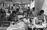 Women sewing on machines at Tuskegee Mills in Macon County, Alabama.