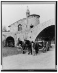 ["Surprise Valley Farm," Arthur Curtiss James property, Beacon Hill Road, Newport, Rhode Island. Courtyard with wagon and team and African American workman]