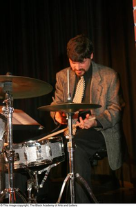 Drummer playing on stage