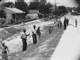 Prisoners leaving the jail in Phenix City, Alabama, probably on their way to work.