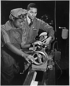 "Under the direction of Cecil M. Coles, NYA foreman, Miss Juanita E. Gray learns to operate a lathe machine at the Washington, DC, NYA War Production and Training Center. This former domestic worker is one of hundreds of Negro women trained at this center."