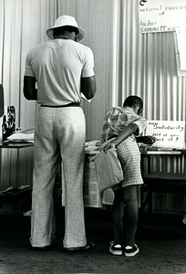 Man and boy at welfare rights table