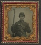 [Unidentified young soldier in Union uniform with shoulder scales and forage cap with Company I insignia holding revolver and bayoneted musket]