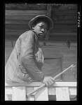 [Untitled photo, possibly related to: Young Negro, member of a family who had moved out of the Santee-Cooper Basin. Near Bonneau, South Carolina]