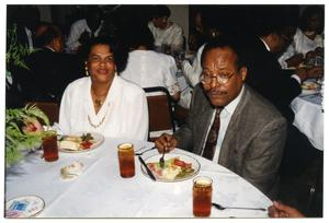 Man, Woman, and Guests at Dorothy Washington Lunch