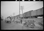 [Untitled photo, possibly related to: Day laborers being hired for cotton picking on Mississippi and Arkansas plantations. Between four and six-thirty every morning during the season, near the Hallan Bridge in Memphis, Tennessee, crowds of Negroes in the streets gather and are loaded into trucks by drivers who bid, and offer them anywhere from fifty cents to one dollar per day]