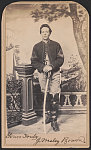 [Commissary Sergeant John Wesley Bowen of Co. G, 15th Pennsylvania Cavalry Regiment in uniform with sword in front of painted backdrop showing tent and landscape]