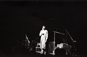 Taj Mahal in concert at Northfield, Mass.: Taj Mahal at front of stage, clapping