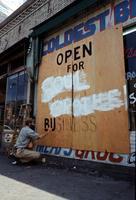 Riots; Detroit; Race Riot.--Windows boarded up - 1 picture.--Stop sign in wreckage - 1 picture.--”Peace on Earth” sign on building - 1 picture.--Used in “A Time of Tragedy”. A special section, Re: Riot. Published by Det. News Aug. 11, 1967.--Enc. 3 negs.