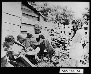 Photograph of girl taking photograph of men eating, Georgia, ca. 1939