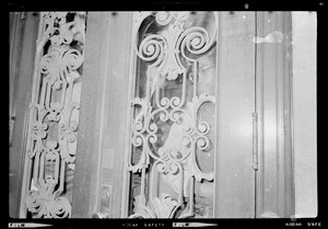 Close up of door with a demonstrator seen in the window of the Administration Building at Boston University