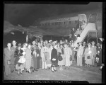 Group of Californians boarding airplane to visit Father Divine, 1949