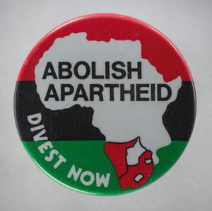 Pinback button protesting apartheid and economic investment in South Africa