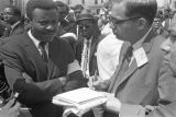 J. Anthony Lukas of the New York Times interviewing a man who had been addressing the crowd on Auburn Avenue just down the street from Ebenezer Baptist Church, at Martin Luther King, Jr.'s funeral.