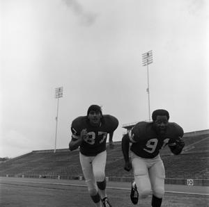 Two football players running, 13