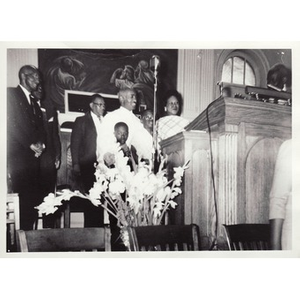 Hunter family stands at front of church