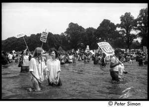 Splashing in the Reflecting Pond during the Poor Peoples’ Campaign Solidarity Day Protesters holding signs reading 'No more hunger U.S.A.' and 'Build at home, don't destroy abroad'