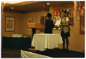 Woman Presenting Award at Service to Youth Award Program