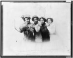 [Four students of the National Training School for Women and Girls, Washington, D.C., posed with a basketball]