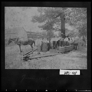 Photograph of men watching demonstration of new hay baler, Tennille, Washington County, Georgia, 1905 June