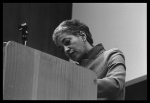 June Jordan, speaking at the podium