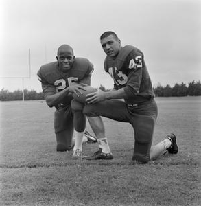 Two football players kneeling together, 4