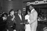 Jerry Robinson receiving an award at the Pied Piper nightclub, Los Angeles, 1986