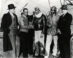 Photo taken on return flight from Washington D.C. and Negro Colleges enroute, L to R: James Hill, Cornelius R. Coffey, Dale S. White, Chauncey Spencer, Horace B. Cayton, 18 April 1939