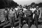 Marchers during the 20th anniversary reenactment of the Selma to Montgomery March, probably in rural Dallas or Lowndes County, Alabama.