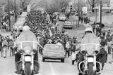 Civil rights marchers on South Jackson Street beside St. Margaret's Hospital in Montgomery, Alabama, headed to the Montgomery County courthouse.