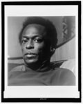 [Miles Davis, head-and-shoulders portrait]