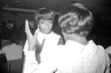 Two women talking at the Elks Club in Montgomery, Alabama, after the wedding of Susie Sanders and Freddie Hubbard.