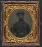 [Unidentified soldier in Union cavalry uniform and Hardee hat with cavalry saber and dual revolvers]