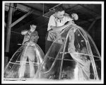 [Untitled photo, possibly related to: Manpower. Negro bomber plant workers. American manpower draws its skills from various racial groups alike. Here, in a large Eastern bomber plant, huge transparent plastic bomber noses are being conditioned for installation on planes which will carry America's offensive to the far conrers of the world. Glenn L. Martin Bomber Plant. Baltimore, Maryland]