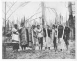 Igorot women use digging sticks to plant rice