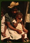 Bayou Bourbeau plantation, a Farm Security Administration cooperative, vicinity of Natchitoches, La. Three Negro children sitting on the porch of a house